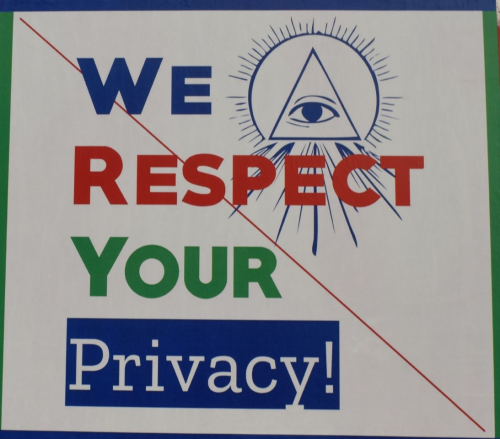Pyramid with eye in its center in front of a sun. TEXT: We Respect Your Privacy!