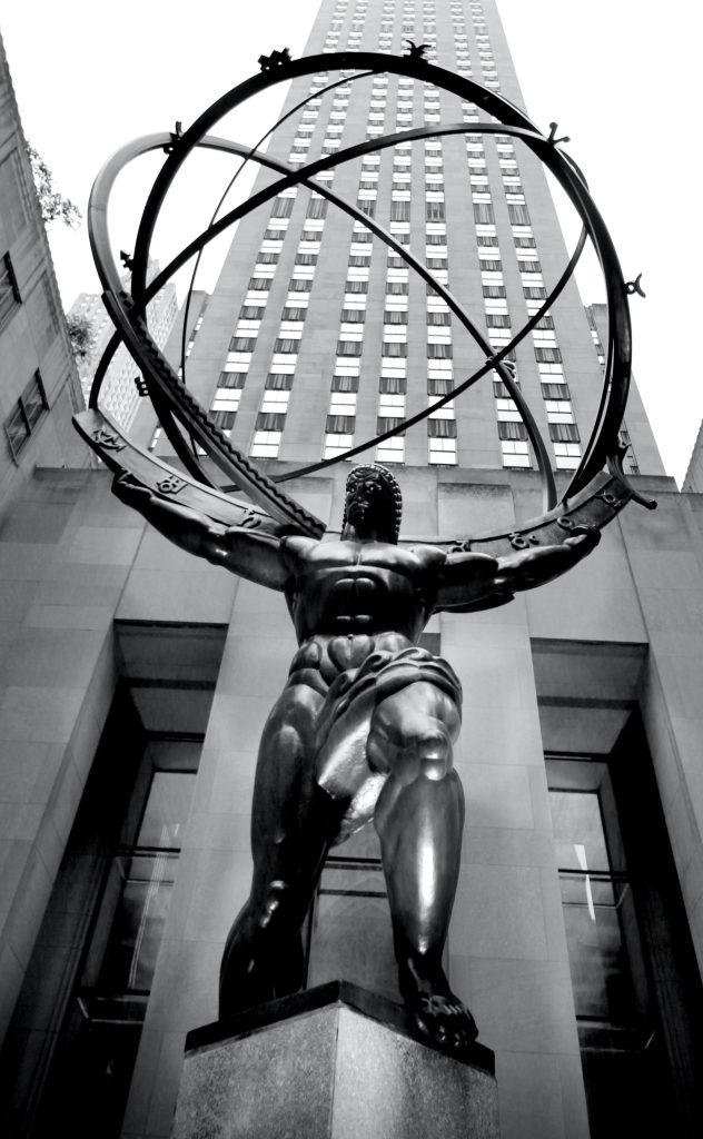 A sculpture of the Titan, Atlas, holding a sphere.